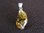 Silver Claw Set Amber Pendant
